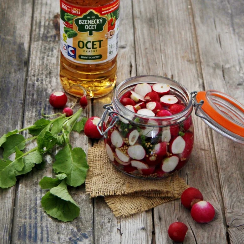 Pickled radishes with vinegar bottle