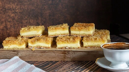 Cheesecake bars on wood board