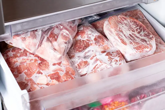 Frozen meat in freezer drawer